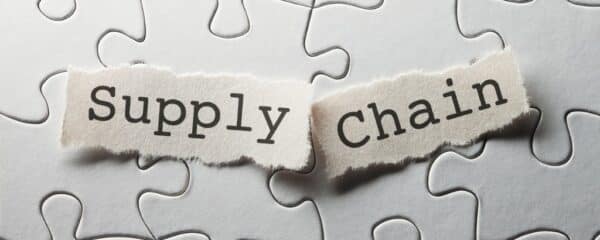 two scraps of paper with the words Supply and Chain placed next to each other